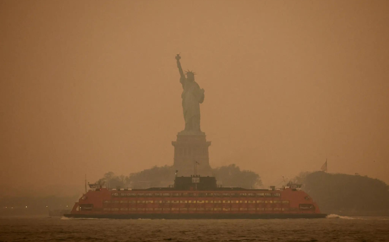 APOCALYPTIC SKIES; NEW YORKERS STRUGGLE TO SEE AND BREATHE
