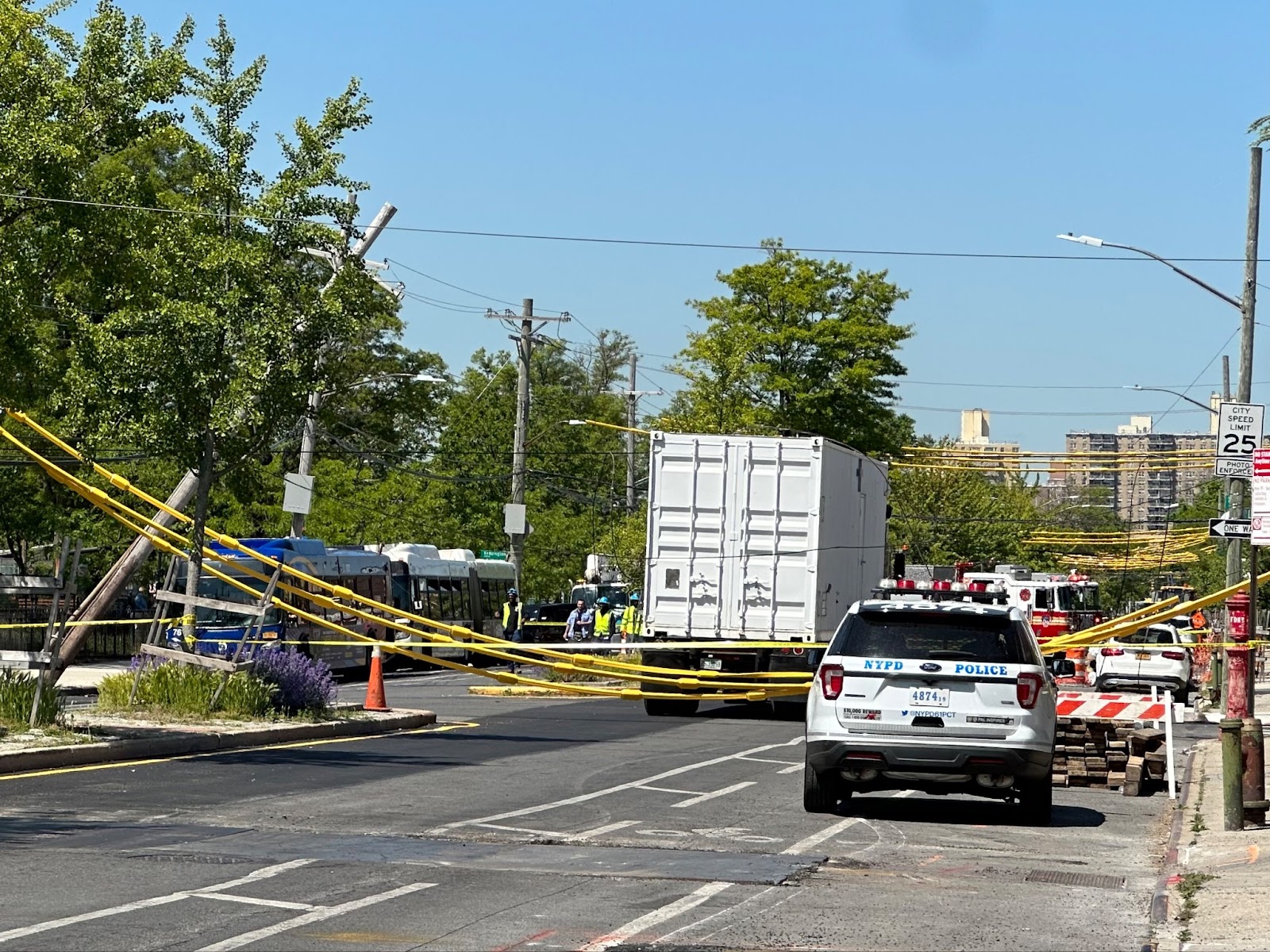 SEMI-TRUCK TOPPLES POWER LINES AND UTILITY POLE ATOP A B49 BUS; DRIVER INJURED